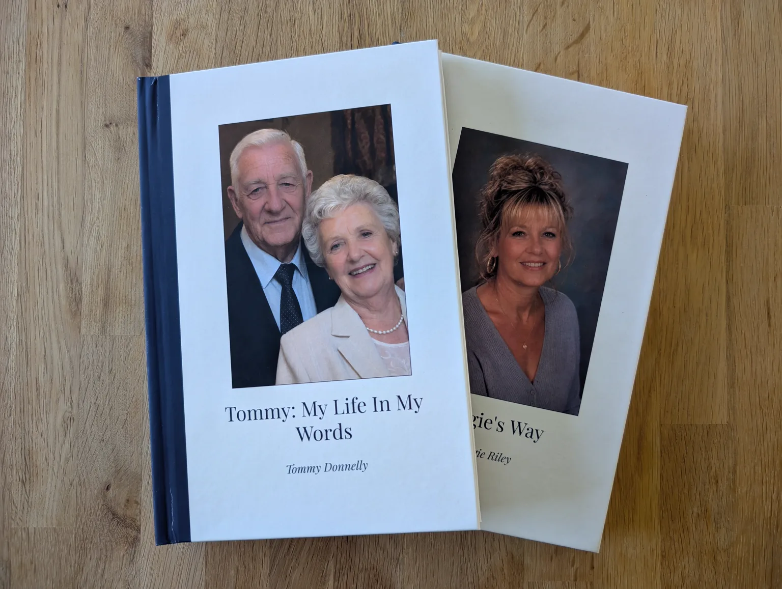 Two finished Biography Studio hardbacks on a table